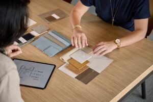 Haworth – Planning & Design Designer reviewing finish samples and floor plans as part of the design process